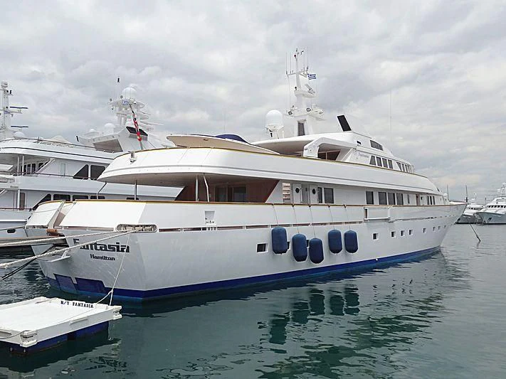 a large white boat in the water aboard FANTASIA Yacht for Sale