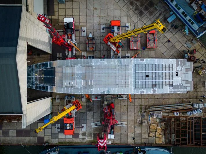 a group of cranes working on a building aboard JFA 50M ALUMINIUM EXPLORER Yacht for Sale