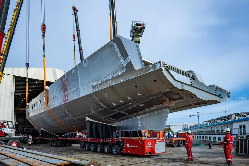 a large ship being loaded with cargo aboard JFA 50M ALUMINIUM EXPLORER Yacht for Sale
