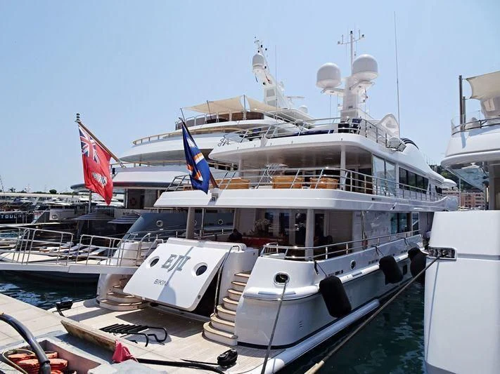 a large boat docked at a pier aboard HALO Yacht for Sale
