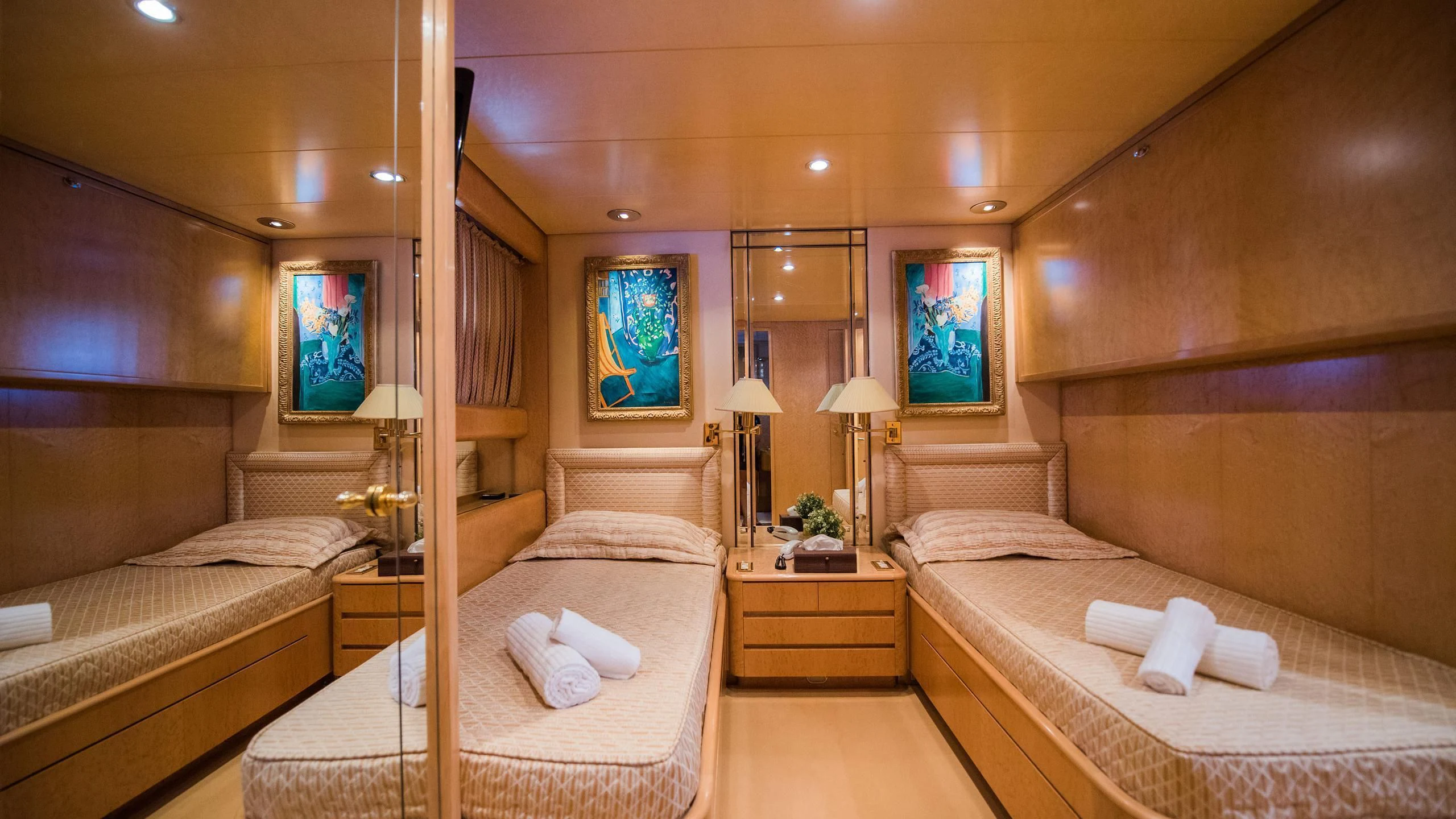 a room with a couple beds aboard CHATO Yacht for Sale