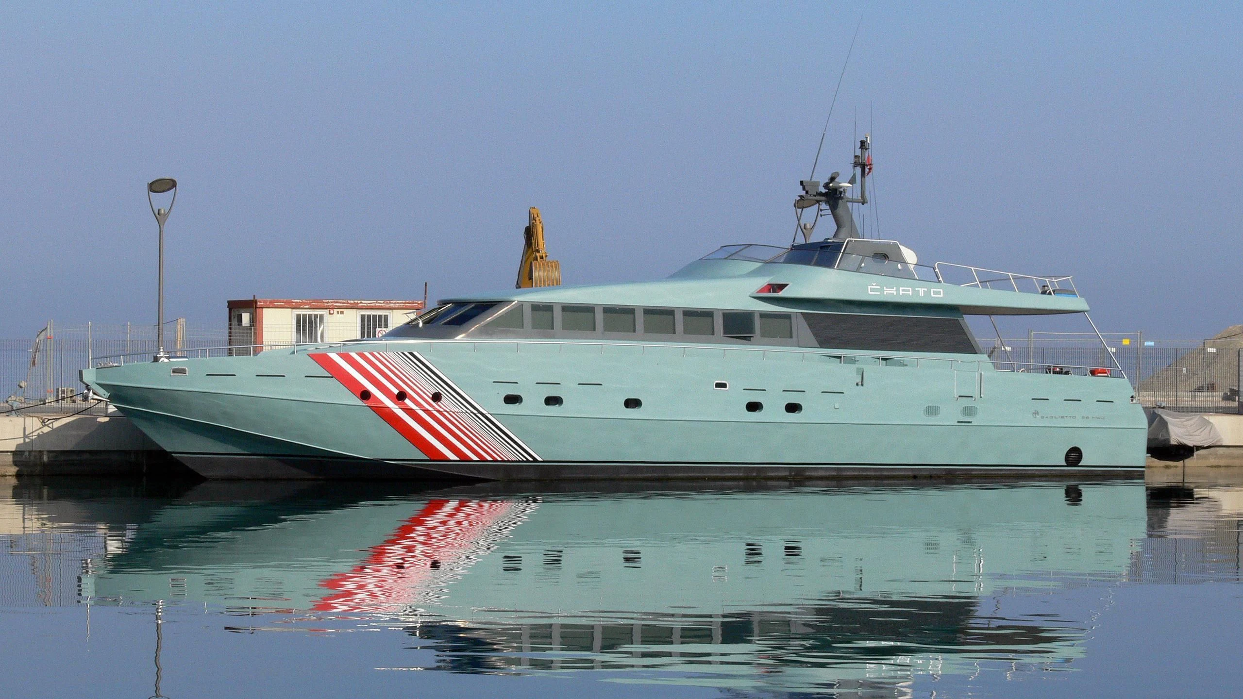 a large white boat in the water aboard CHATO Yacht for Sale