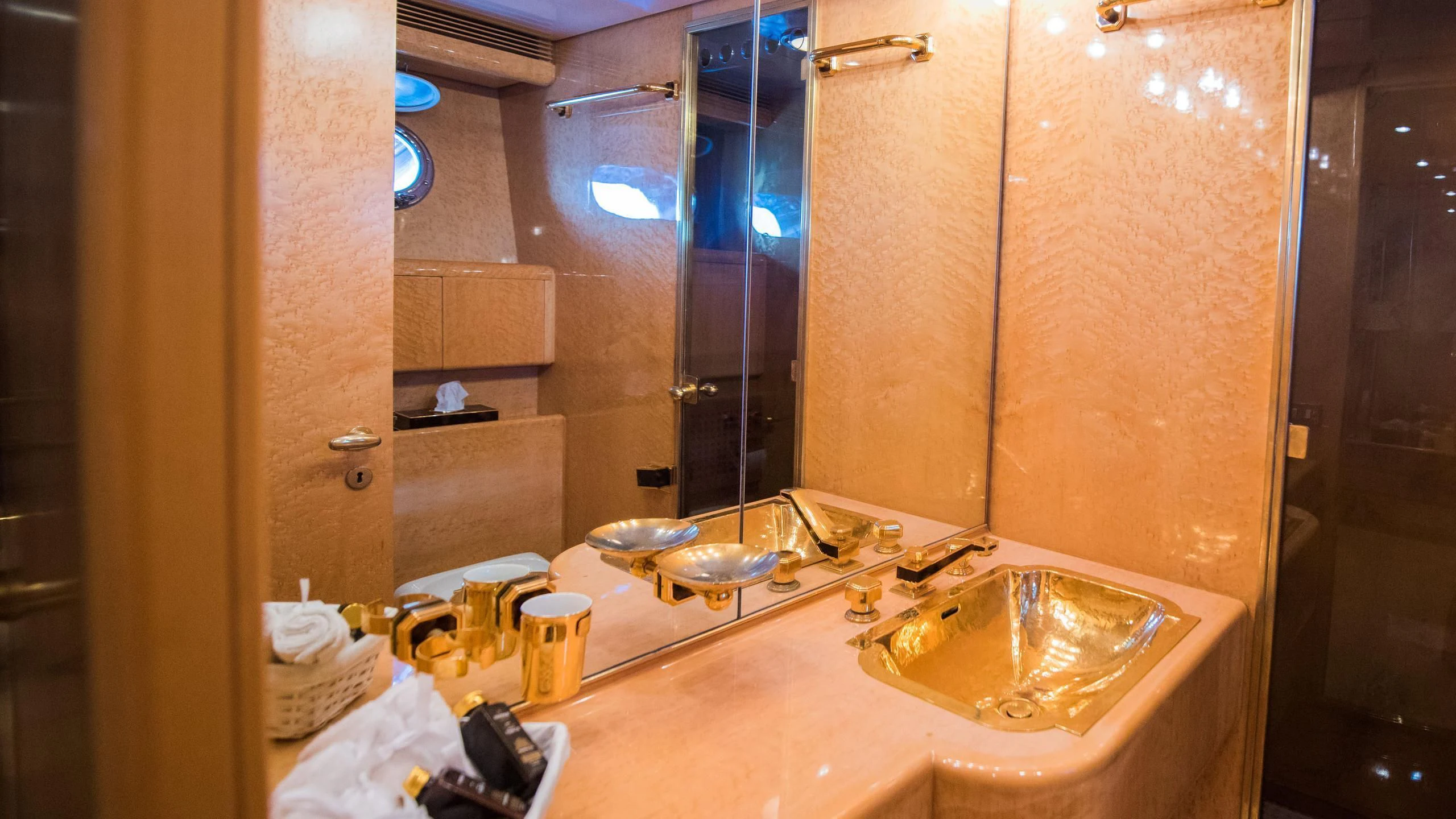 a bathroom with a large mirror aboard CHATO Yacht for Sale