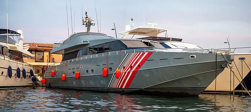 a boat docked at a pier aboard CHATO Yacht for Sale