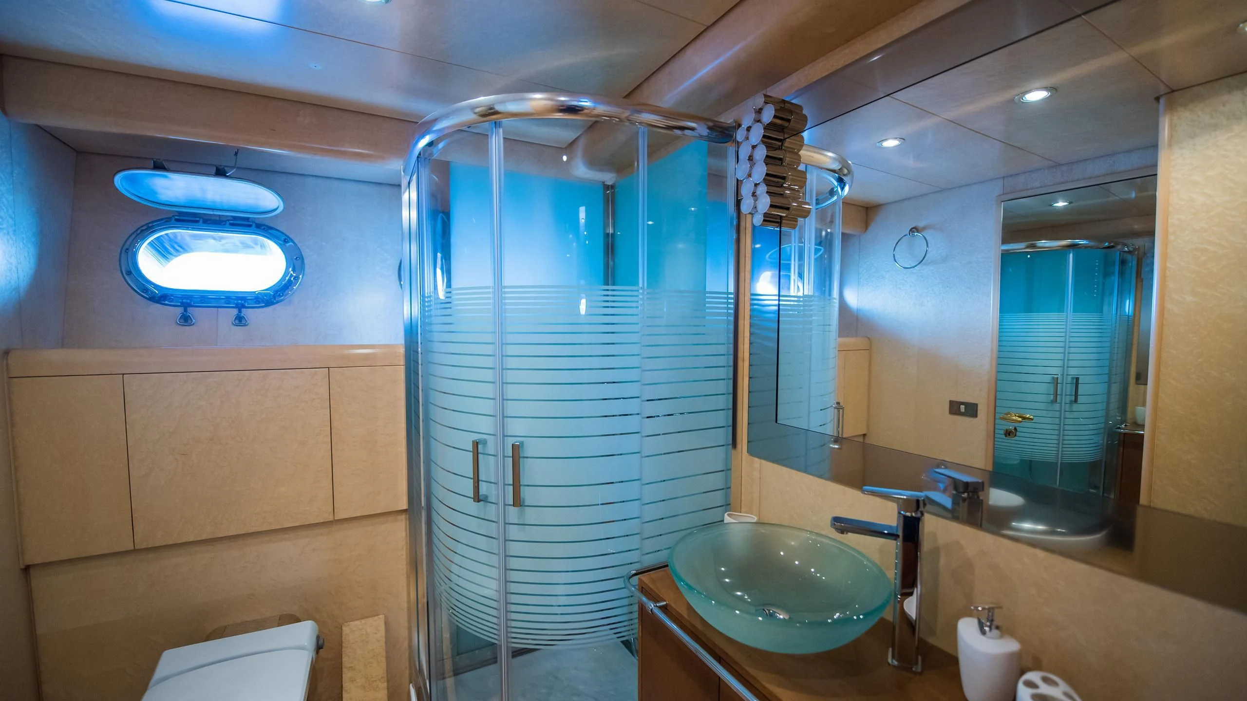 a bathroom with a glass shower aboard CHATO Yacht for Sale