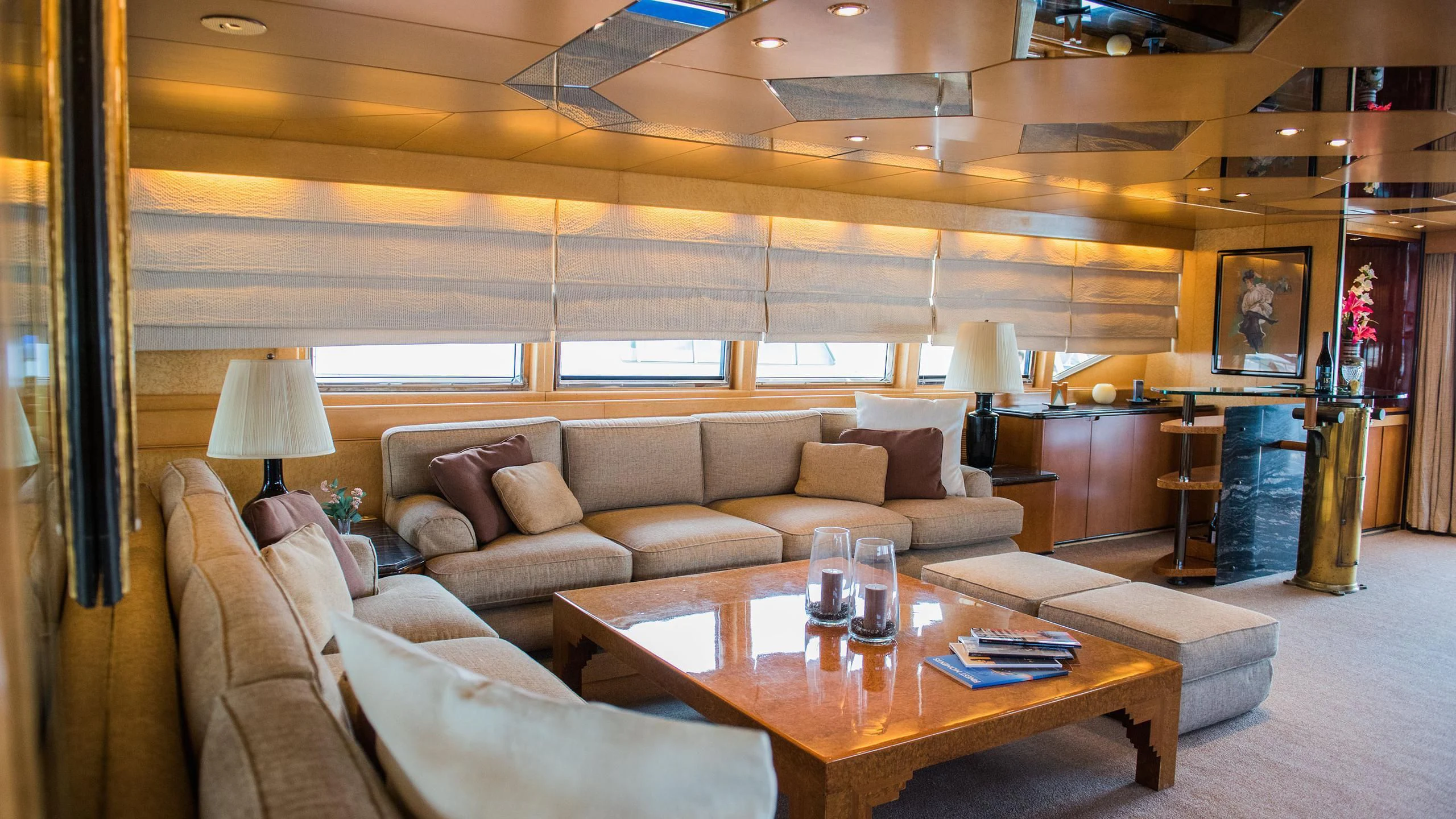 a living room with a fireplace aboard CHATO Yacht for Sale