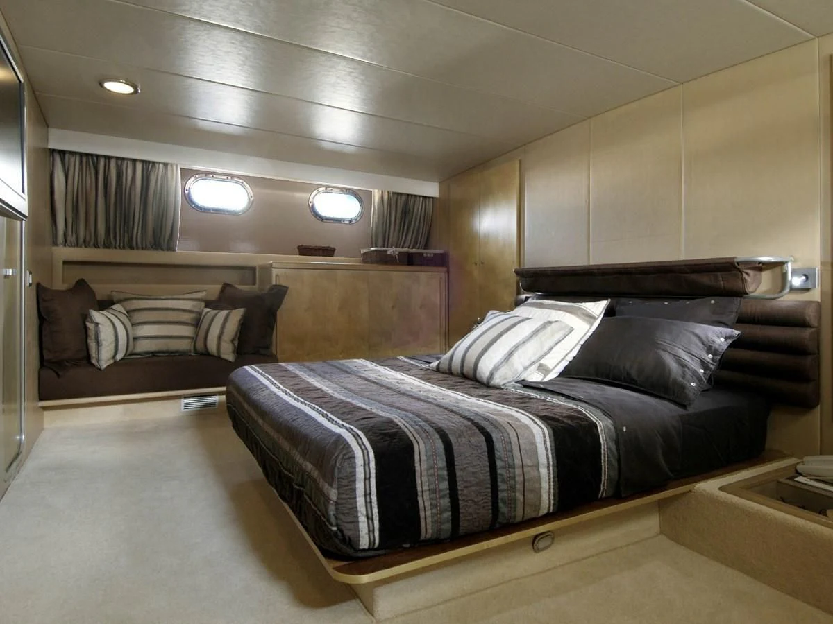 a bed in a room aboard CHATO Yacht for Sale