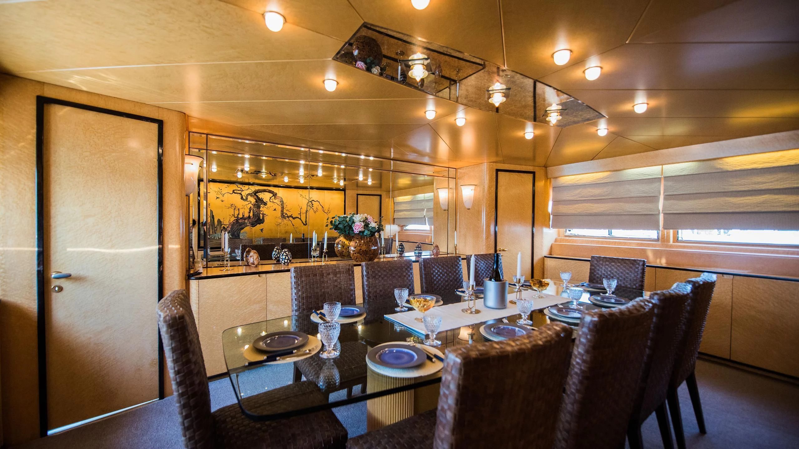 a large kitchen with a dining table aboard CHATO Yacht for Sale
