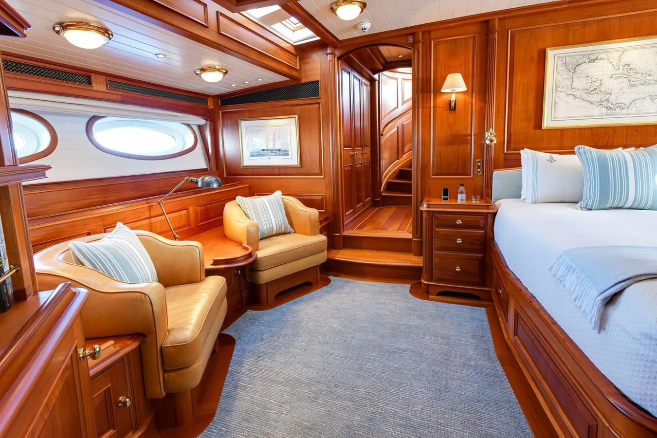 a room with a bed and a couch aboard HERMETICA Yacht for Sale
