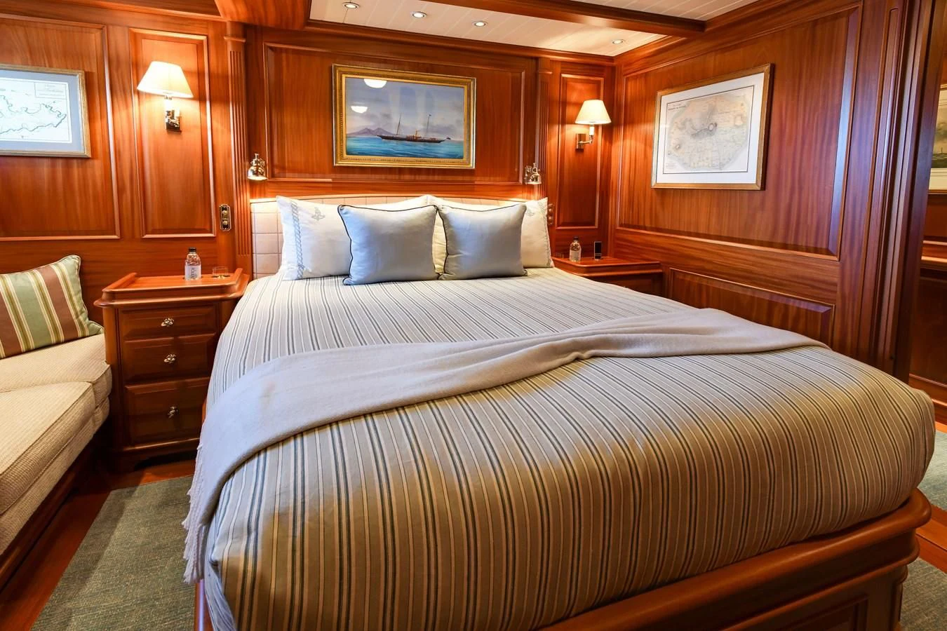 a bed with a white sheet and pillows aboard HERMETICA Yacht for Sale