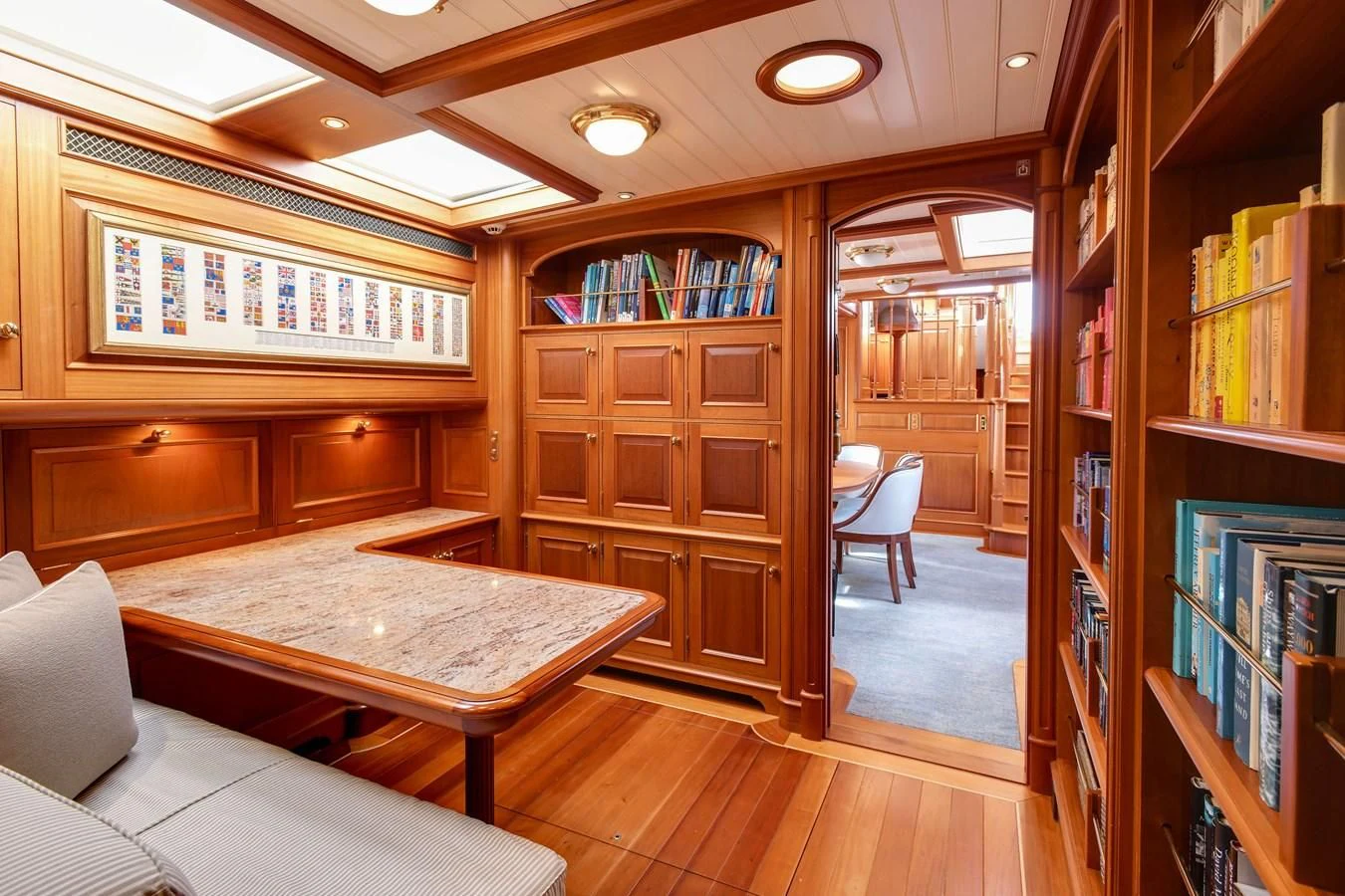a room with a table and chairs aboard HERMETICA Yacht for Sale