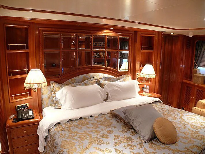 a bed with white sheets aboard BLIND DATE TOO Yacht for Sale