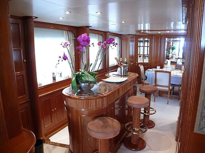 a kitchen with a table and stools aboard BLIND DATE TOO Yacht for Sale