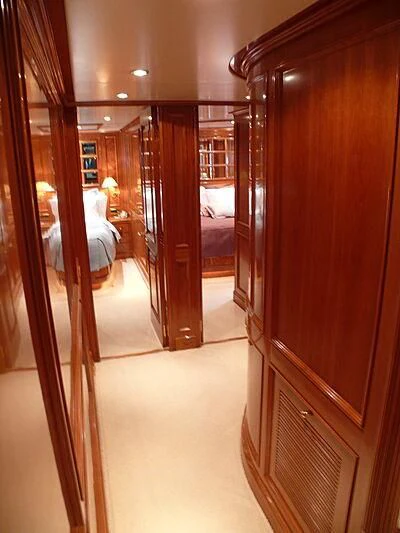 a room with a wood door and a bed in it aboard BLIND DATE TOO Yacht for Sale