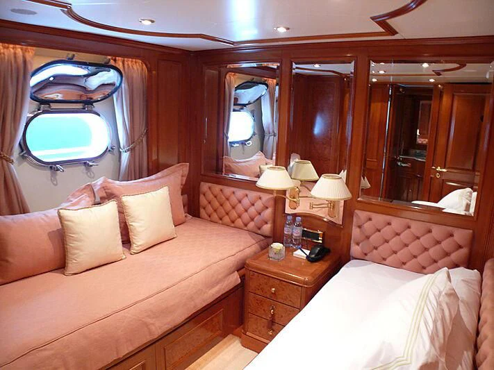 a hotel room with a bed and a mirror aboard BLIND DATE TOO Yacht for Sale