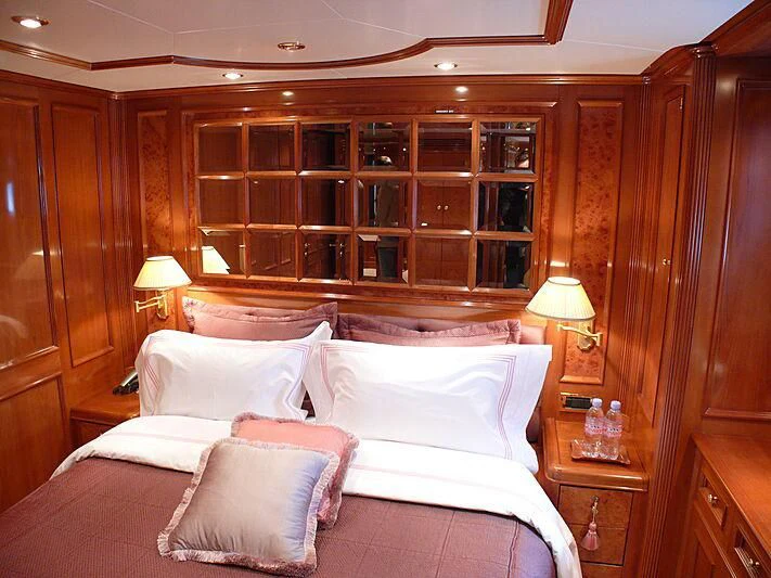 a bed with white sheets aboard BLIND DATE TOO Yacht for Sale
