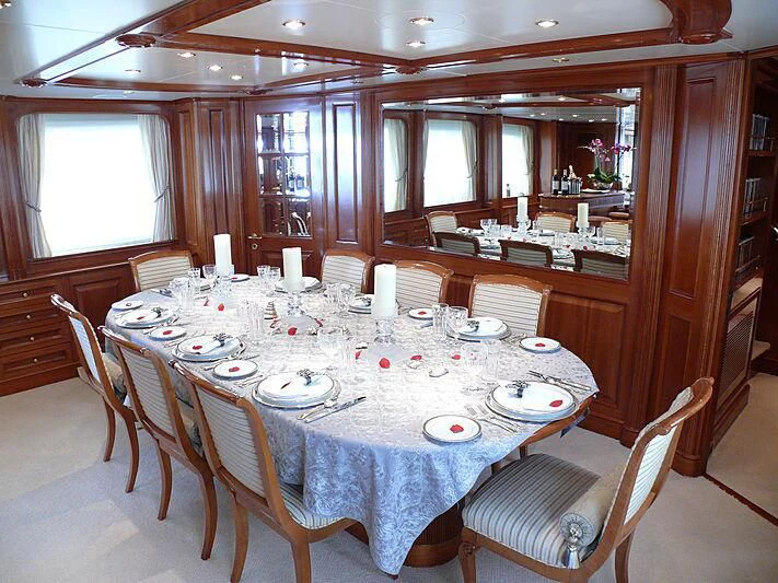 a dining room with a table set aboard BLIND DATE TOO Yacht for Sale