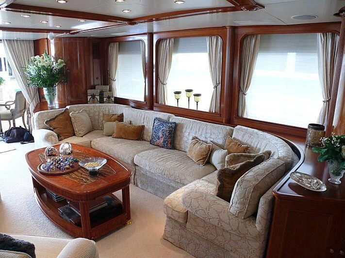a living room with a couch and a table aboard BLIND DATE TOO Yacht for Sale
