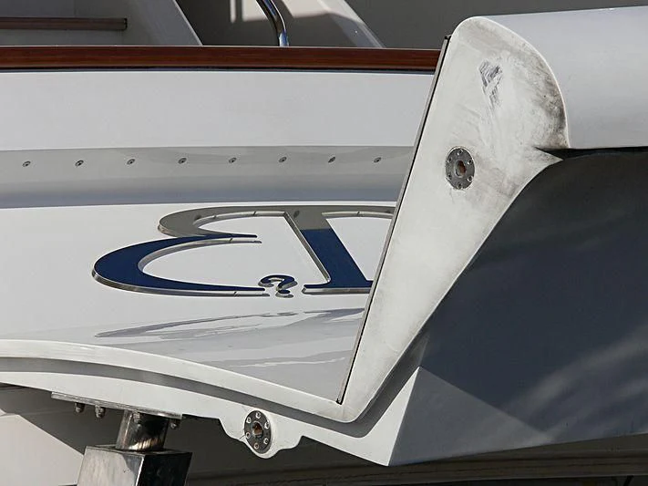 a white airplane with a blue stripe aboard BLIND DATE TOO Yacht for Sale