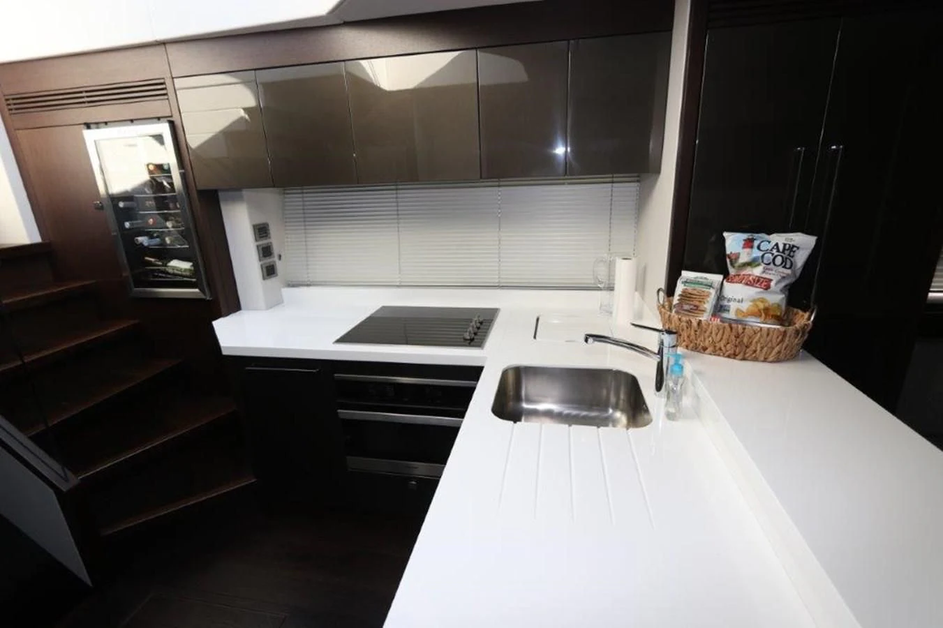 a kitchen with a sink and a stove aboard HIDE OUT Yacht for Sale