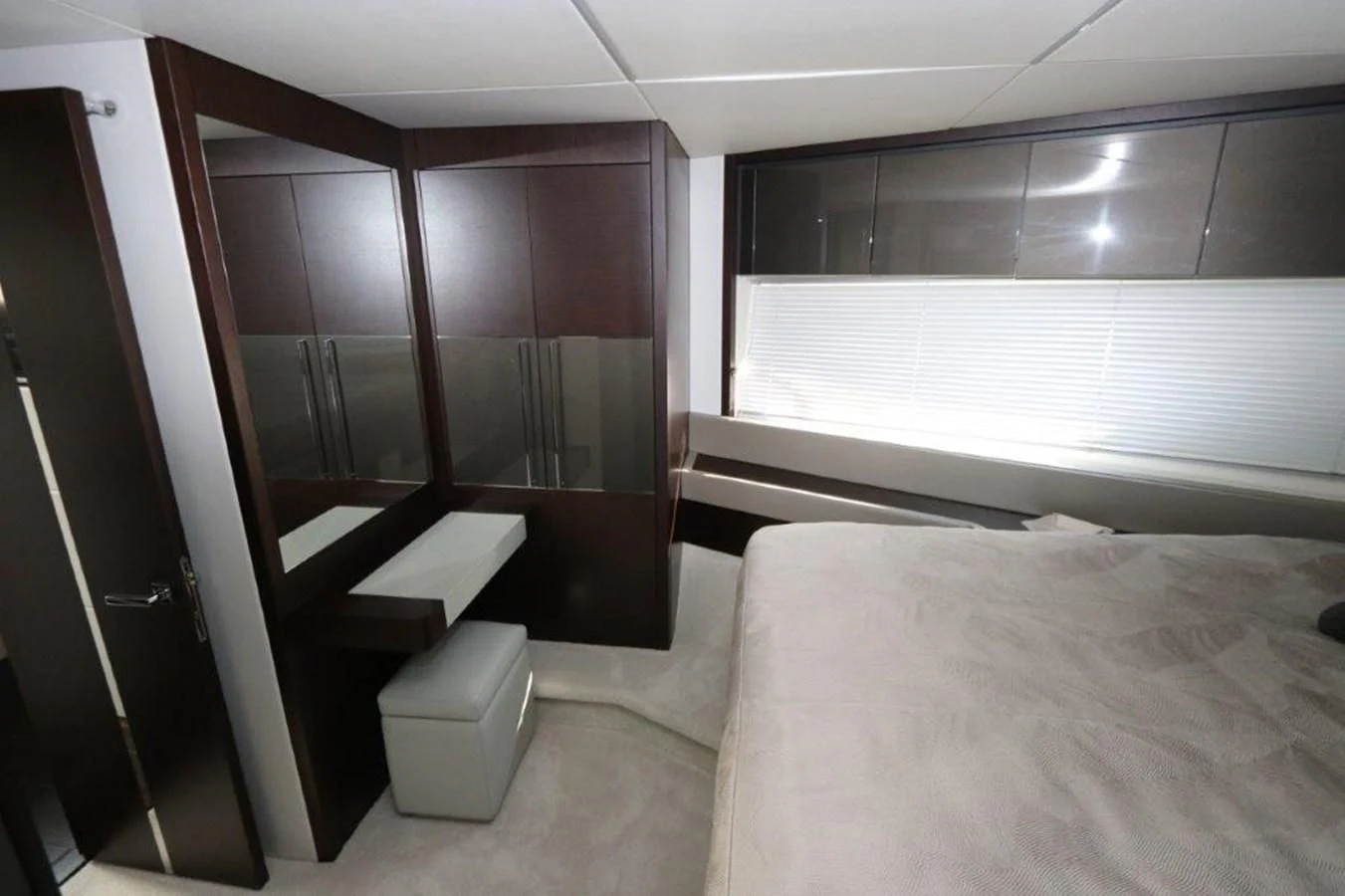 a room with a bed and a desk aboard HIDE OUT Yacht for Sale