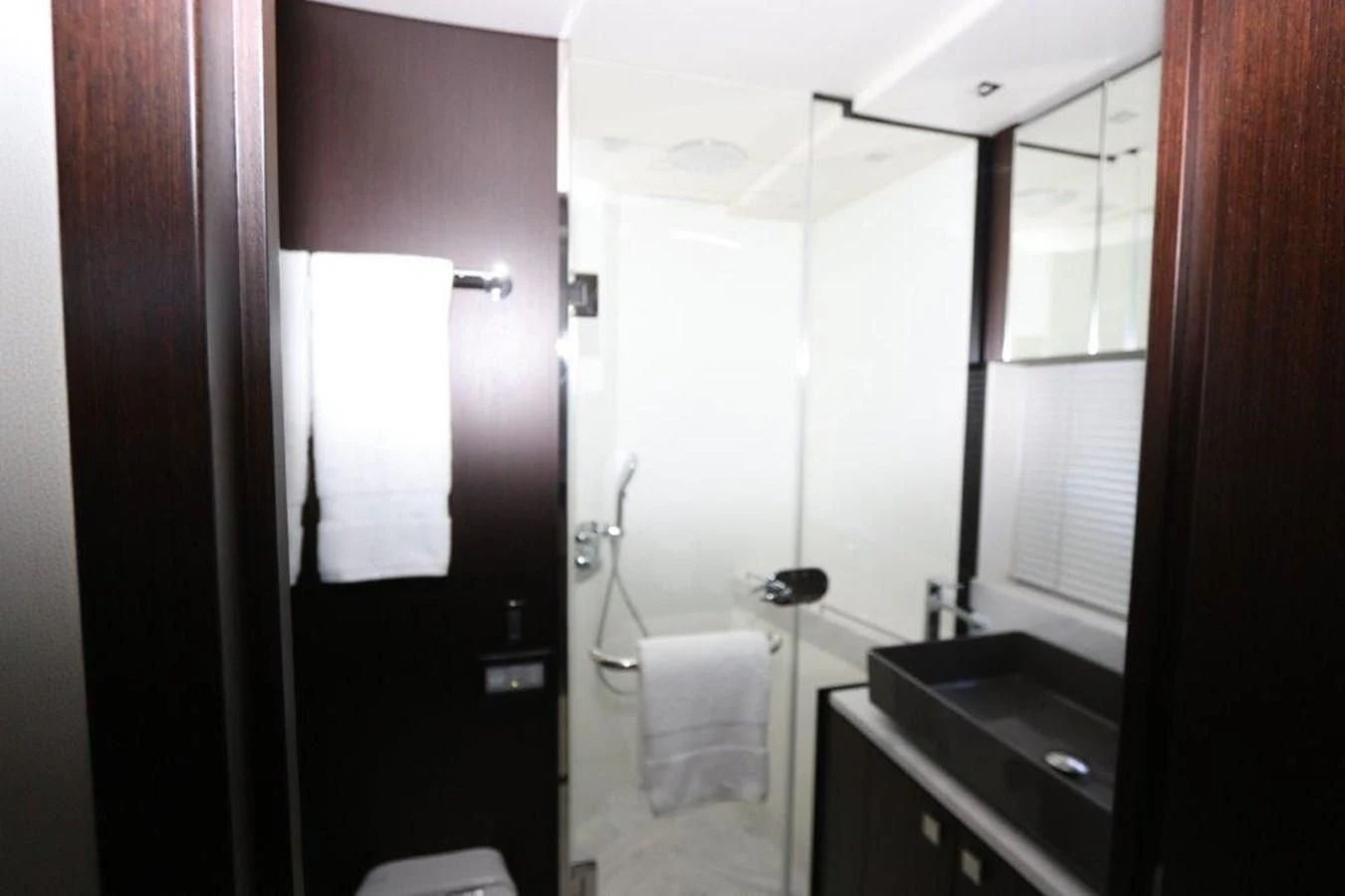 a bathroom with a sink and a mirror aboard HIDE OUT Yacht for Sale