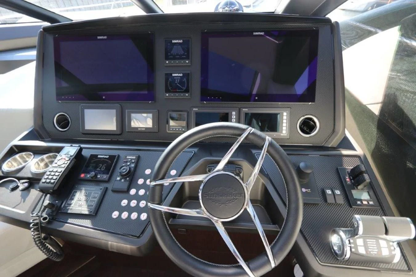 a car with a screen and a steering wheel aboard HIDE OUT Yacht for Sale
