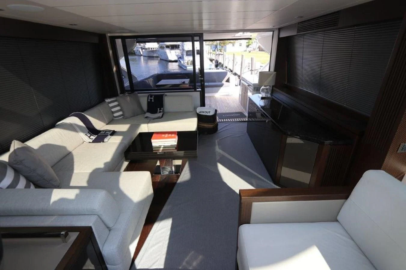 a room with a couch and a television aboard HIDE OUT Yacht for Sale