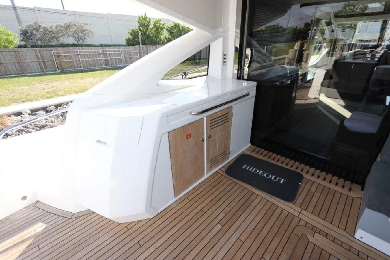 a large white machine on a wooden deck aboard HIDE OUT Yacht for Sale