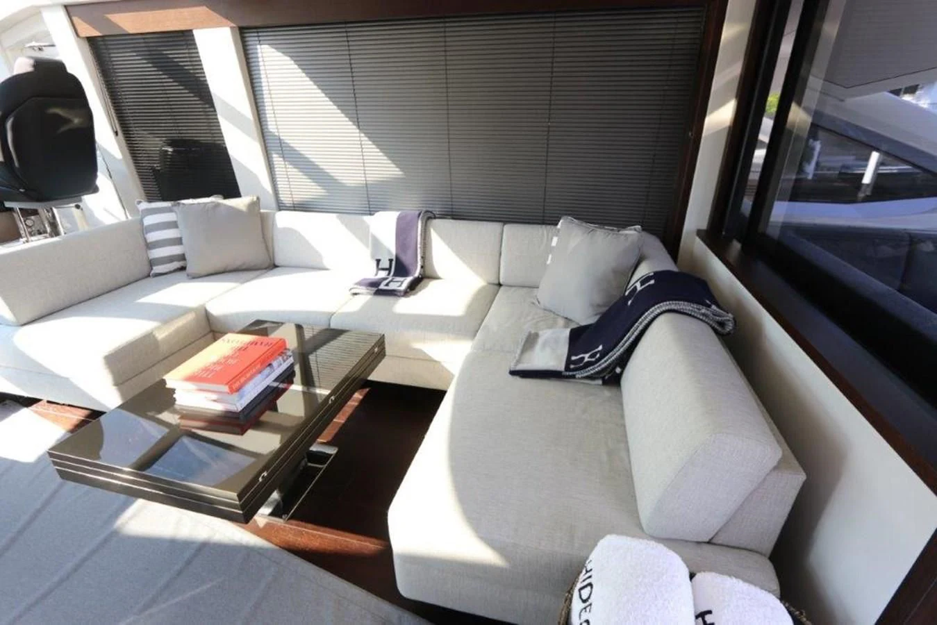 a room with a couch and a coffee table aboard HIDE OUT Yacht for Sale