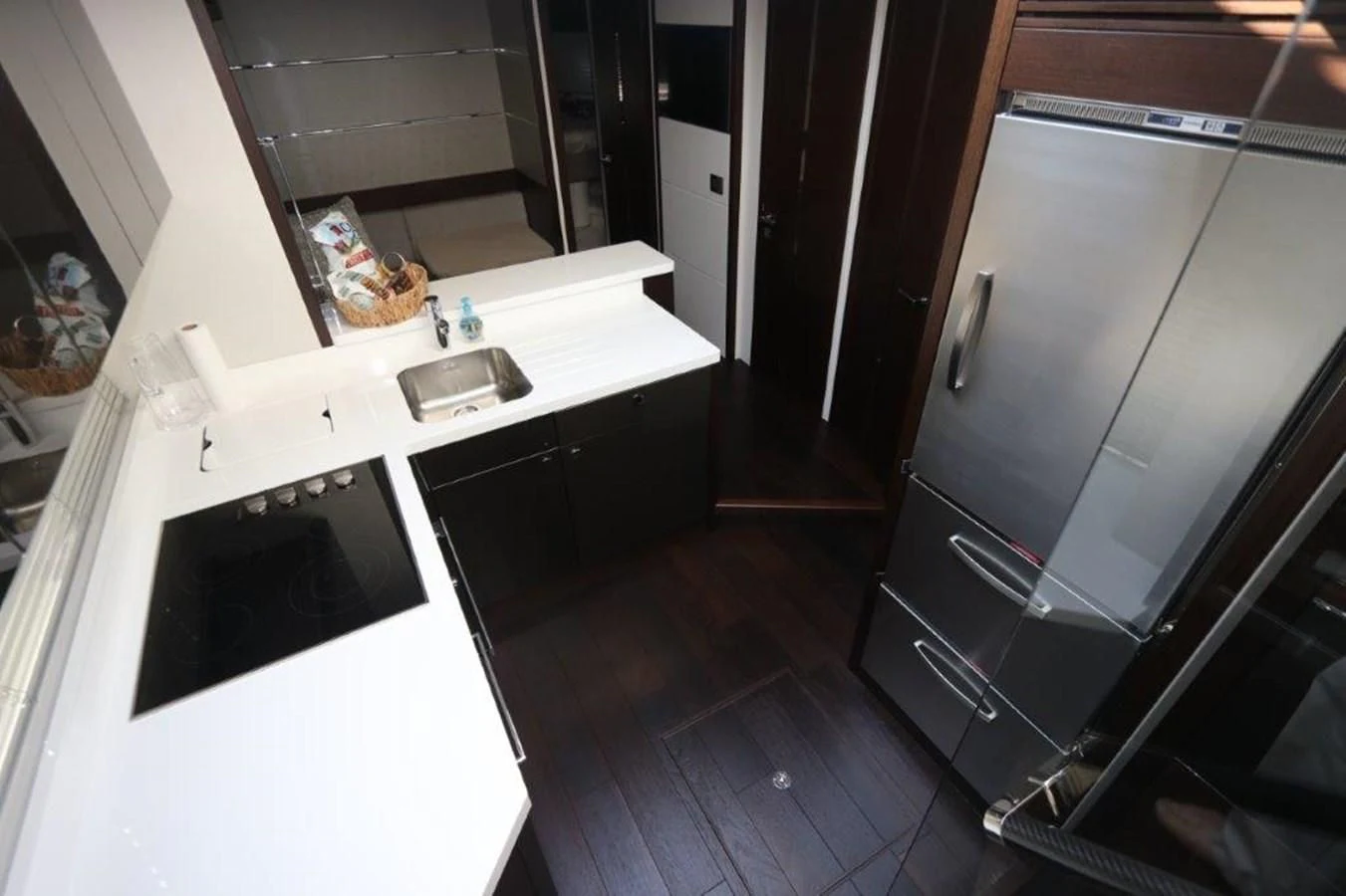 a kitchen with a sink and cabinets aboard HIDE OUT Yacht for Sale