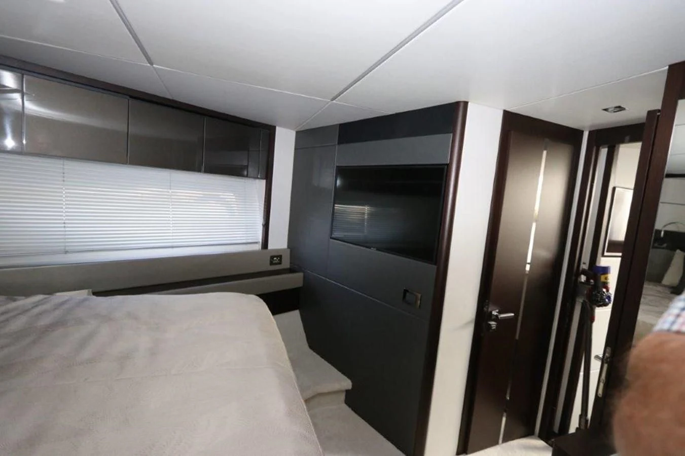 a room with a bed and a door aboard HIDE OUT Yacht for Sale