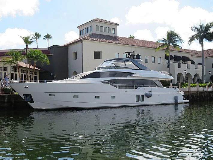 a white yacht docked at a pier aboard CHONY Yacht for Sale