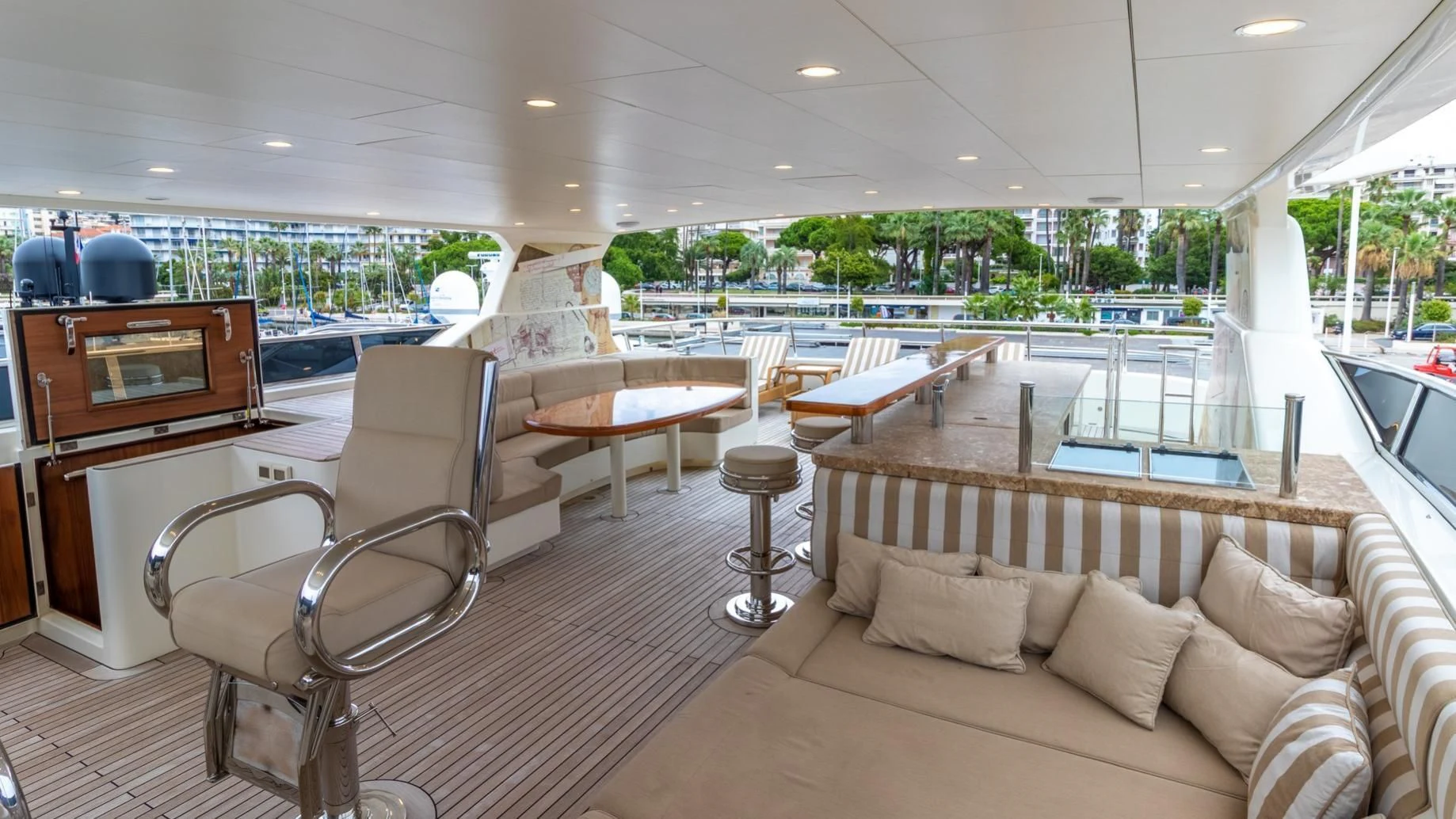 a living room with a large window aboard O Yacht for Sale