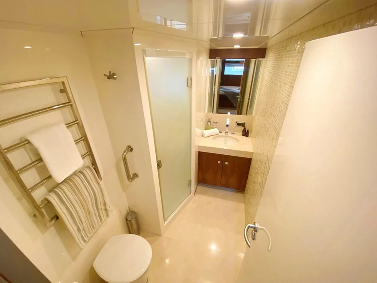 a bathroom with a toilet and a sink aboard O Yacht for Sale