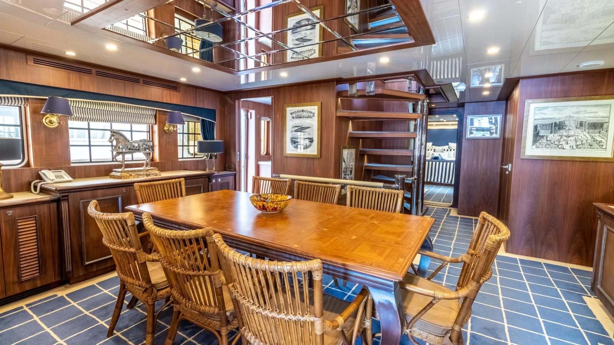 a dining room with a table aboard O Yacht for Sale