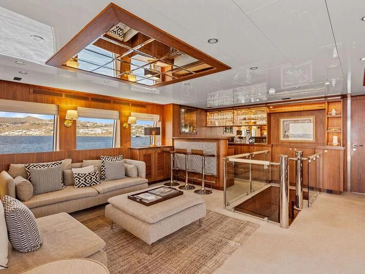 a living room with a large open window aboard O Yacht for Sale