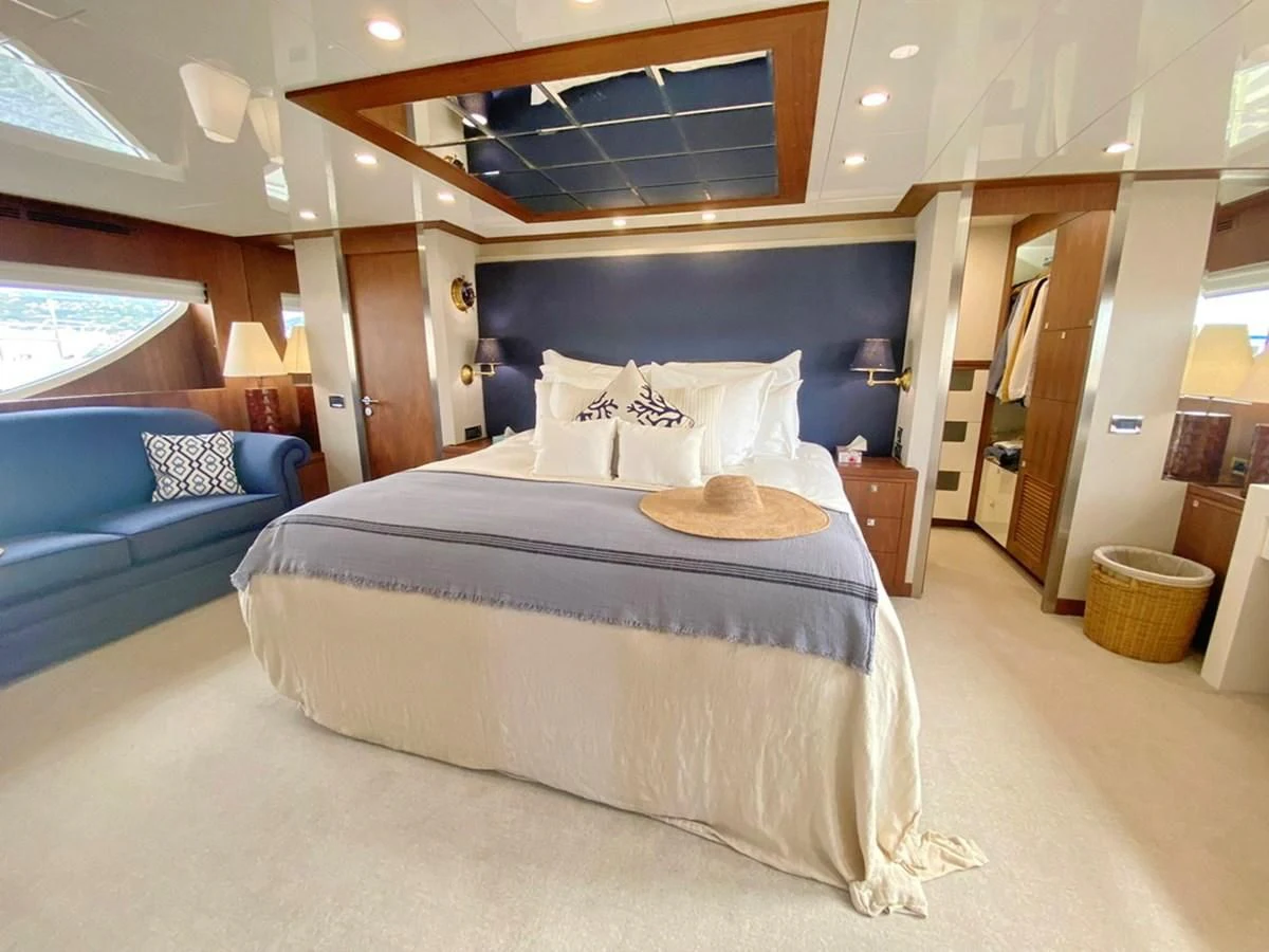 a large bed in a room aboard O Yacht for Sale