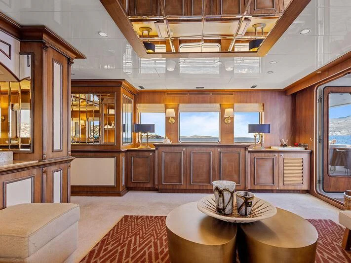 a large kitchen with wooden cabinets aboard O Yacht for Sale