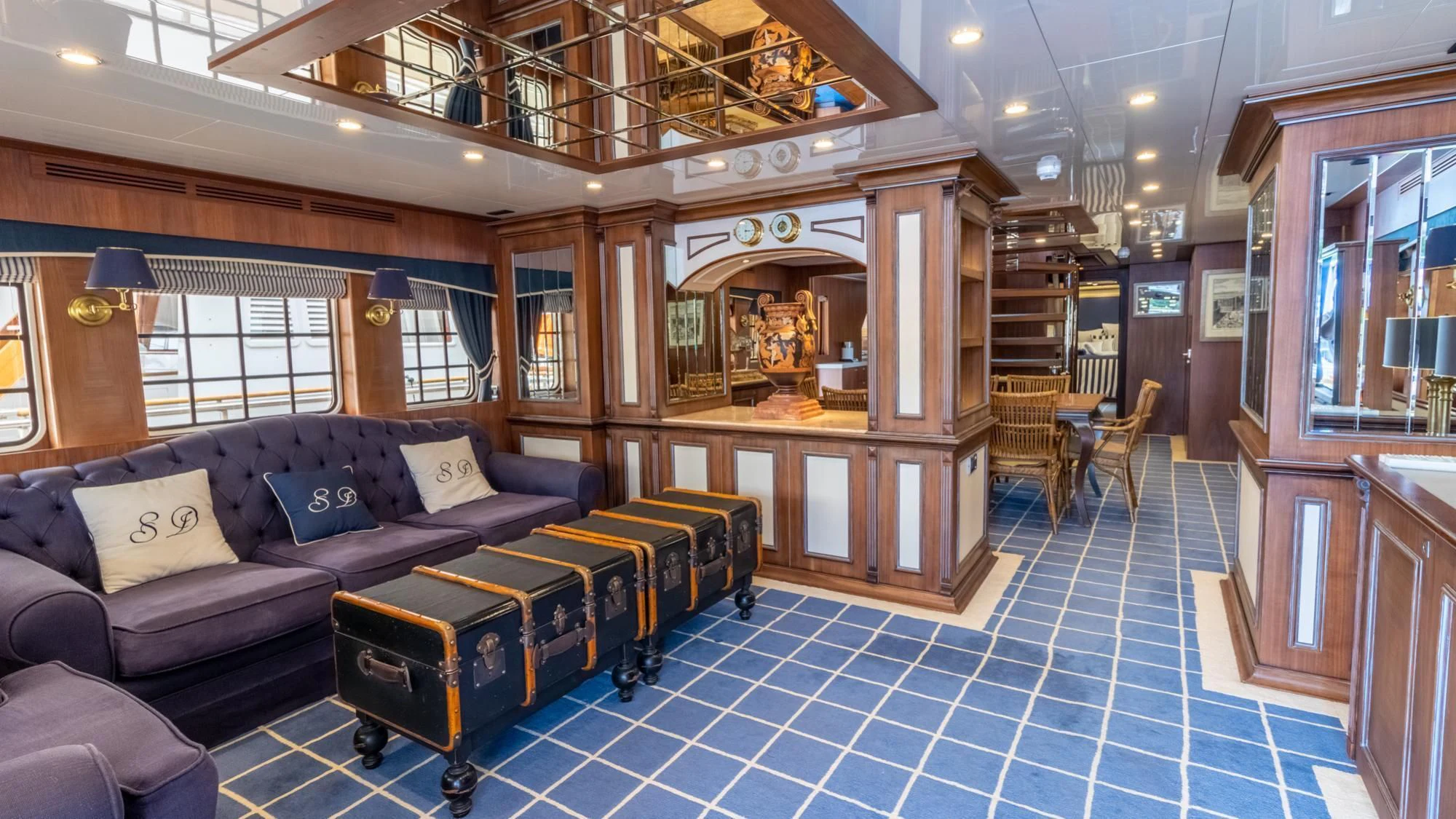 a room with a couch and a table aboard O Yacht for Sale