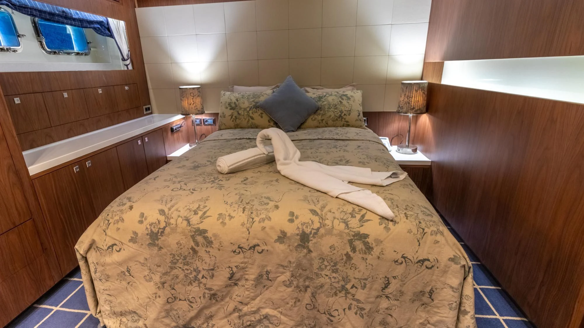 a bed with a large bed aboard O Yacht for Sale