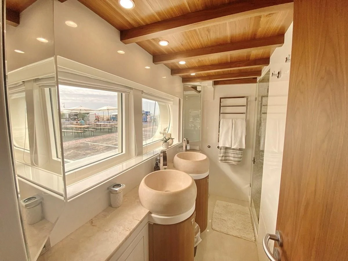 a bathroom with a toilet and a sink aboard O Yacht for Sale