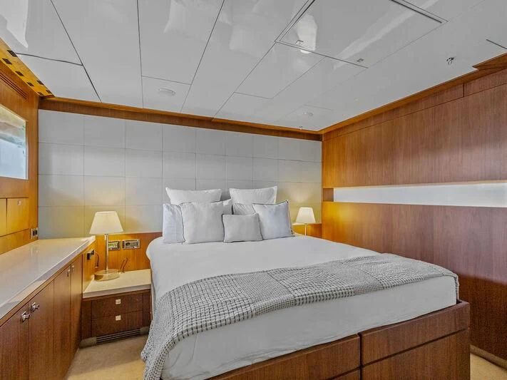 a bed in a room aboard O Yacht for Sale