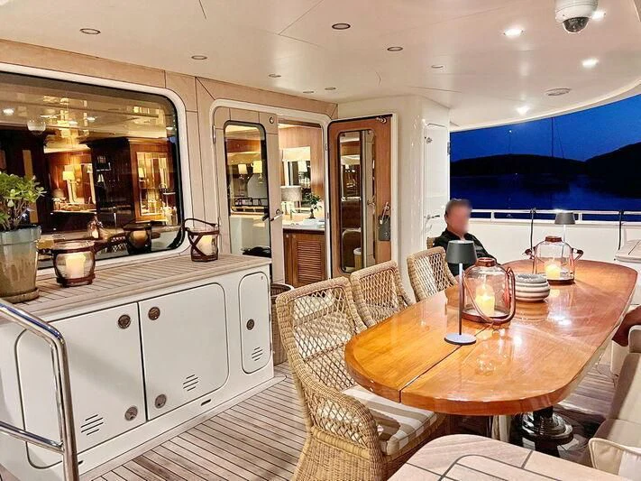 a dining table in a kitchen aboard O Yacht for Sale