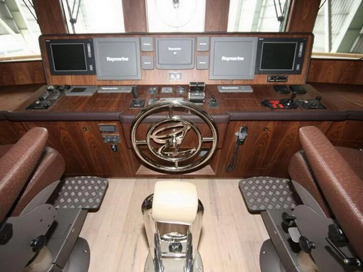 a room with computers and other objects aboard O Yacht for Sale