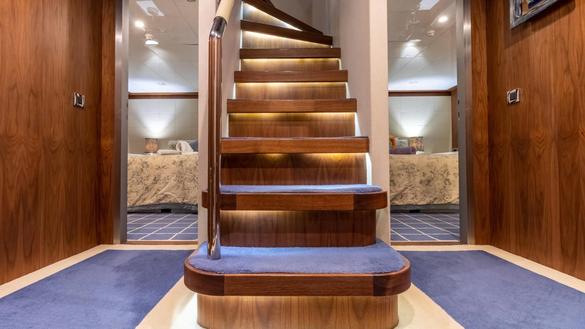a wooden staircase in a building aboard O Yacht for Sale