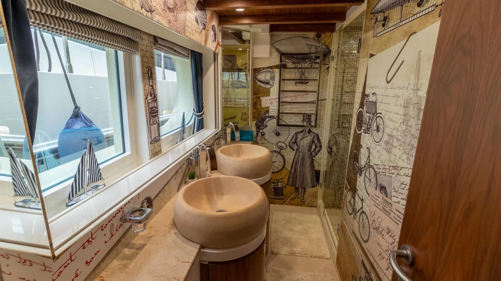 a bathroom with a sink and a mirror aboard O Yacht for Sale