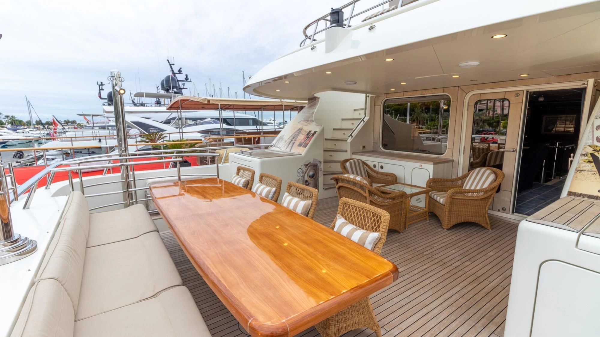 a room with a table and chairs aboard O Yacht for Sale