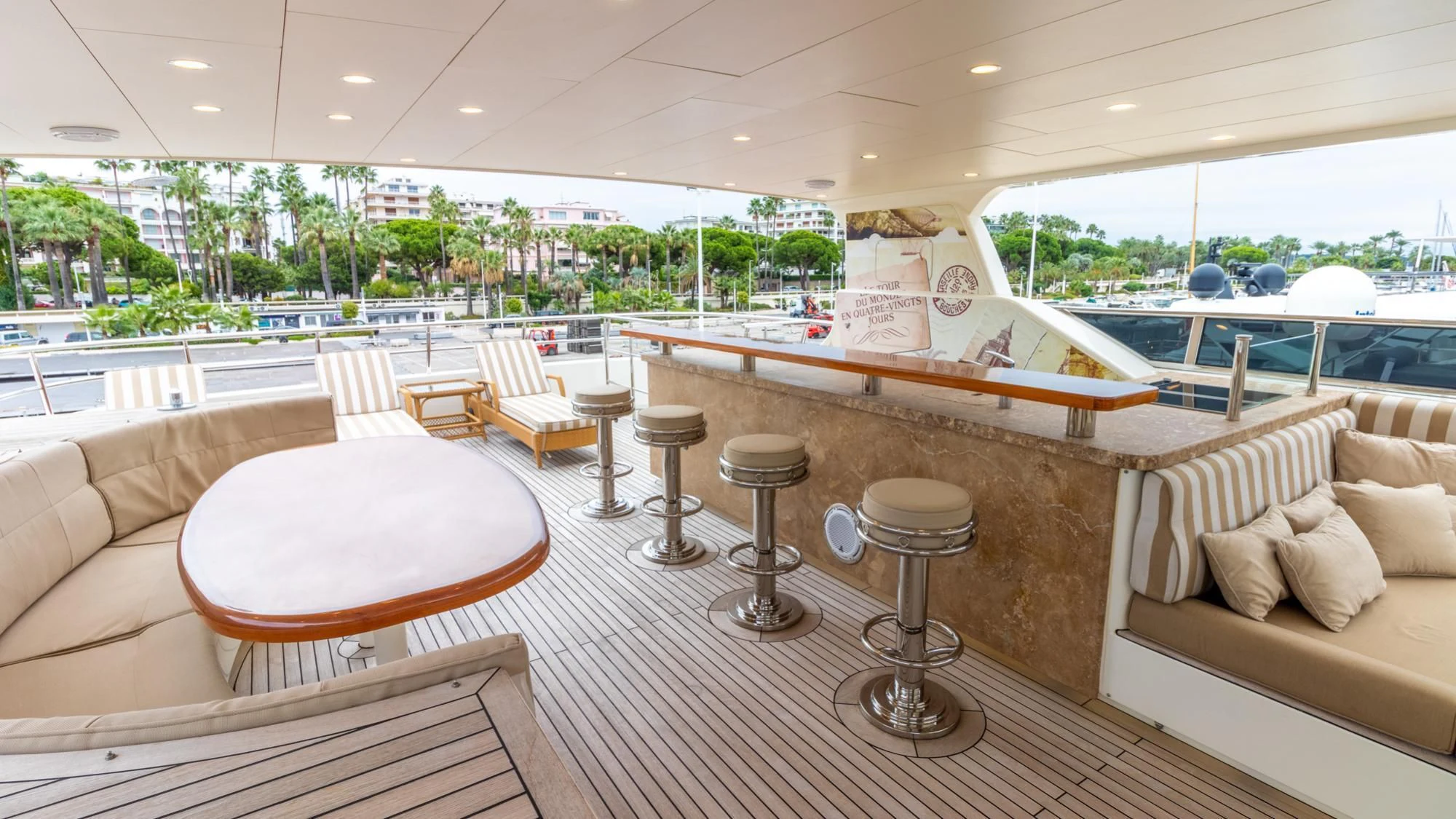 a room with a table chairs and a large window aboard O Yacht for Sale