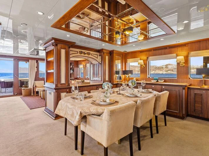 a large dining room with a table aboard O Yacht for Sale